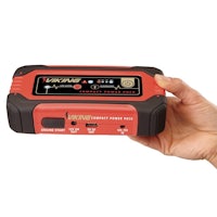 a person holding up a portable battery charger